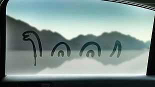 vehicle glass window, artwork, Loch Ness Monster, window, car