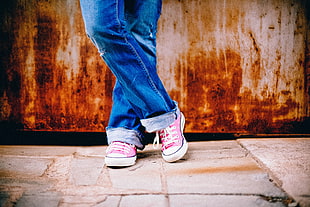blue denim jeans and pink Converse All Star sneakers