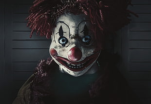 photo of white and red faced joker
