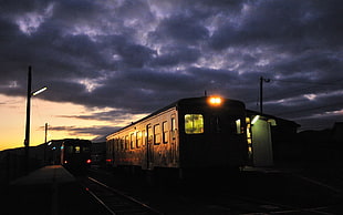 photo of trains during nighttime