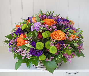 orange and purple Roses and green Chrysanthemums arrangement