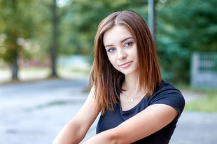 selective focus photography of woman in black shirt