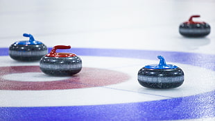 round red pin beside blue pin ball on hockey stadium
