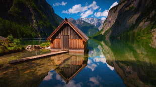 brown wooden house on body of water, obersee lake