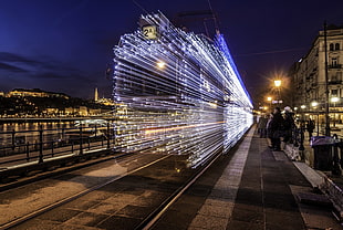 gray metal rail, cityscape, long exposure, train, lights