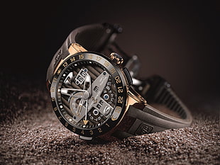 round black chronograph watch with black strap, watch, luxury watches, Ulysse Nardin