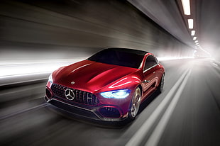red Mercedes-Benz sedan cruising inside tunnel
