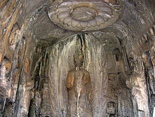 ancient statue engravings on wall interior during daytime HD wallpaper