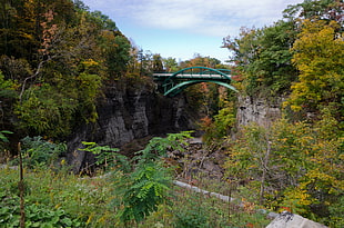 landscape photography of bridge in between mountain HD wallpaper