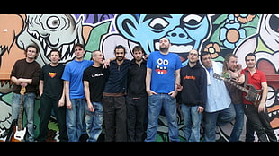 assorted Music artists taking picture with graffiti background HD wallpaper