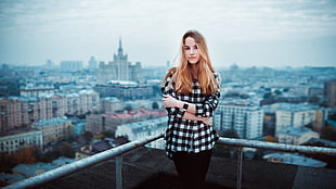 woman in black and white check long-sleeved shirt