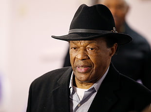 man wearing black hat
