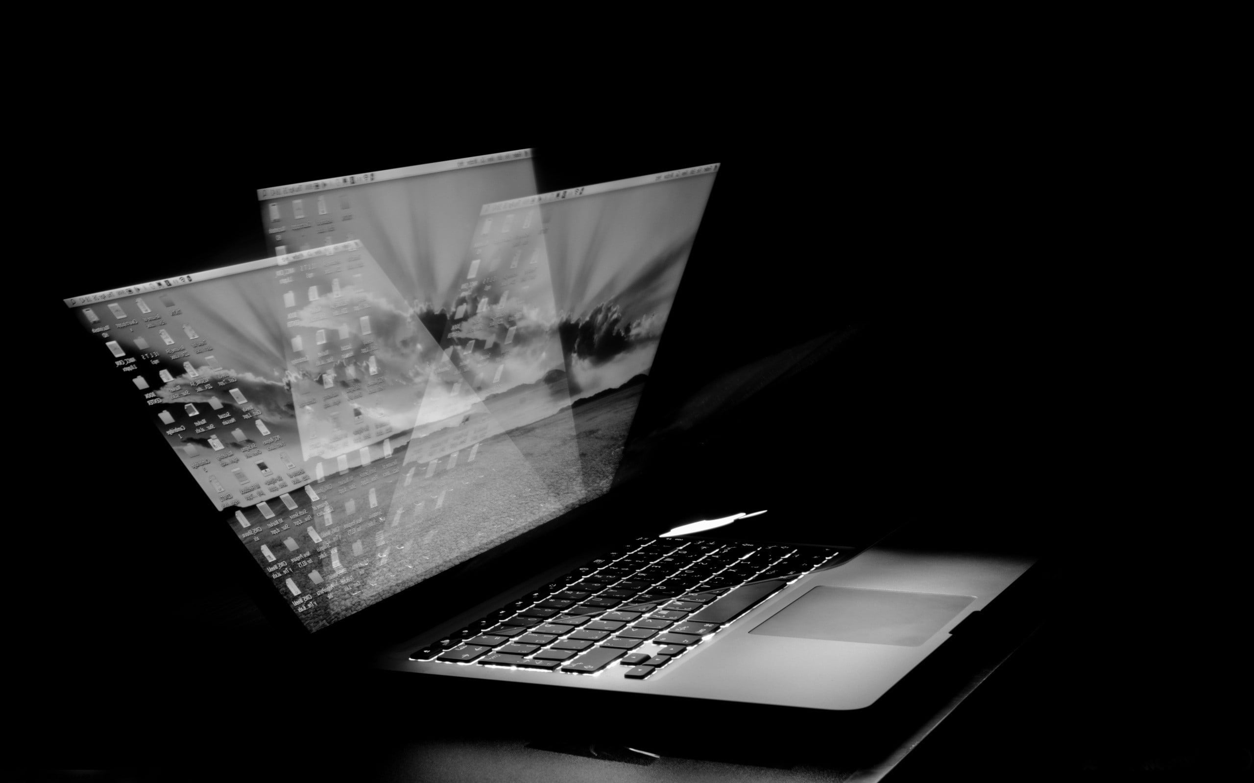 grayscale photo of black laptop computer