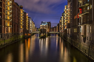 man made canal in between buildings HD wallpaper
