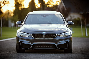 selective focus photography of black BMW car