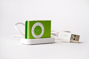 green iPod Shuffle with charger