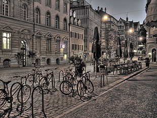 bicycles parked on bike racks during nighttime