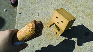 brown ice cream on cone