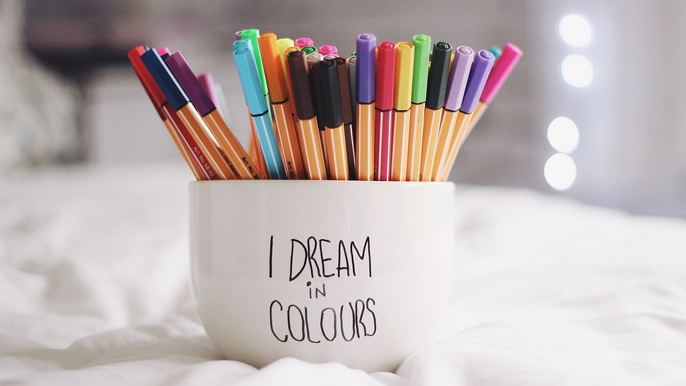 white ceramic cup with assorted color pens HD wallpaper