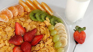 fruit salad with chips and glass of milk