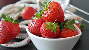 strawberry on white ceramic bowl