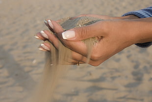 woman holding sand