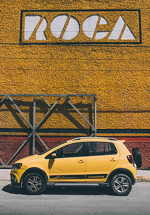 yellow 5-door hatchback HD wallpaper