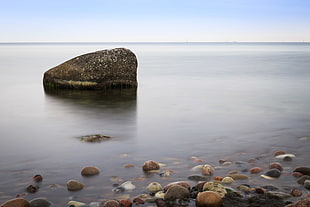 stones in the body of water view during day time HD wallpaper
