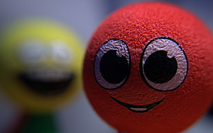 red emoji ball, smiley, blurred