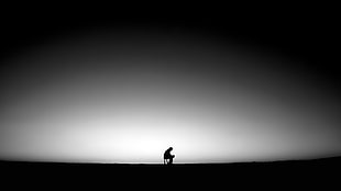 silhouette of person sitting on chair