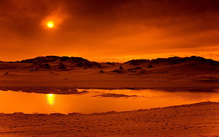 Sunset on sand field with river HD wallpaper