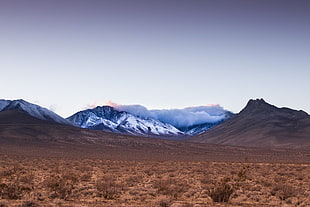 panoramic view of mountains under dark sky