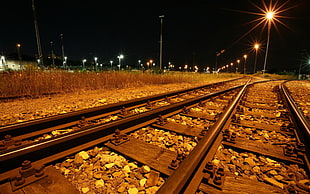 gray train rails, railway, lights, night