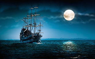 black pirate ship on sea during nighttime HD wallpaper