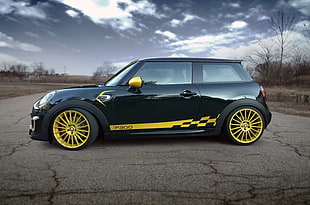 black and yellow Mini Cooper on road