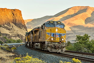 brown and blue train, train, vehicle, railway, cliff HD wallpaper