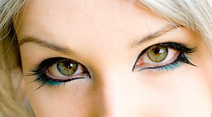closeup of \woman wearing green and black eyeshadow HD wallpaper