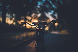 black and grey bicycle during sunset