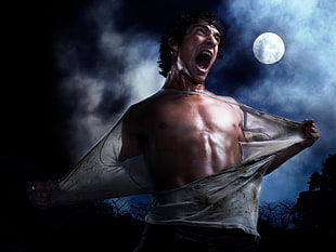 person reaping shirts under moon light