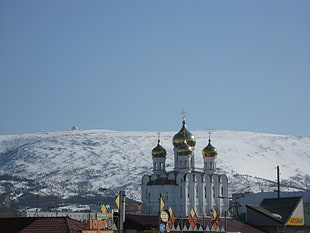 gold and white Mosque across white hills