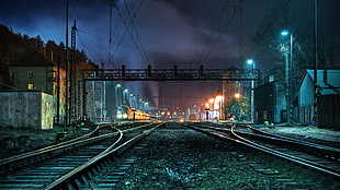 train rails photo during nighttime