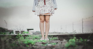 deep of field photography of woman standing