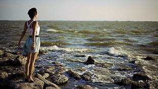 woman standing near the sea HD wallpaper
