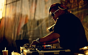 man using DJ console