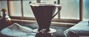 black and white ceramic vase, ultra-wide, depth of field, coffee