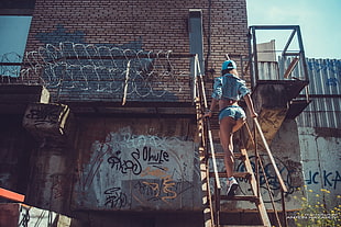 woman walking on stair during daytime HD wallpaper