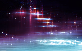 close-up photograph of body of water with lights