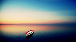red and white canoe on body of water during daytime HD wallpaper