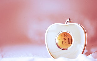 apple-shape digital alarm clock at 2:18 display