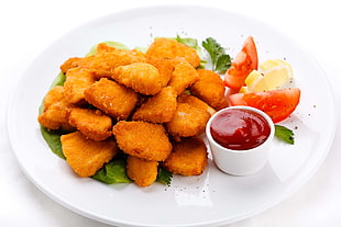 chicken nuggets with tomatoes and sauce